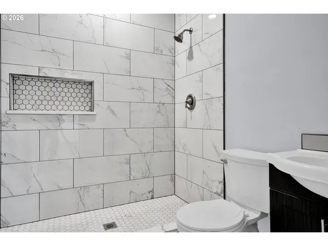 a bathroom with a sink and mirror