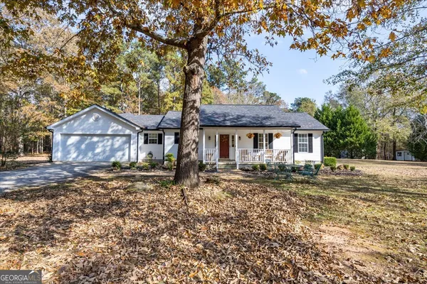 a front view of a house with yard