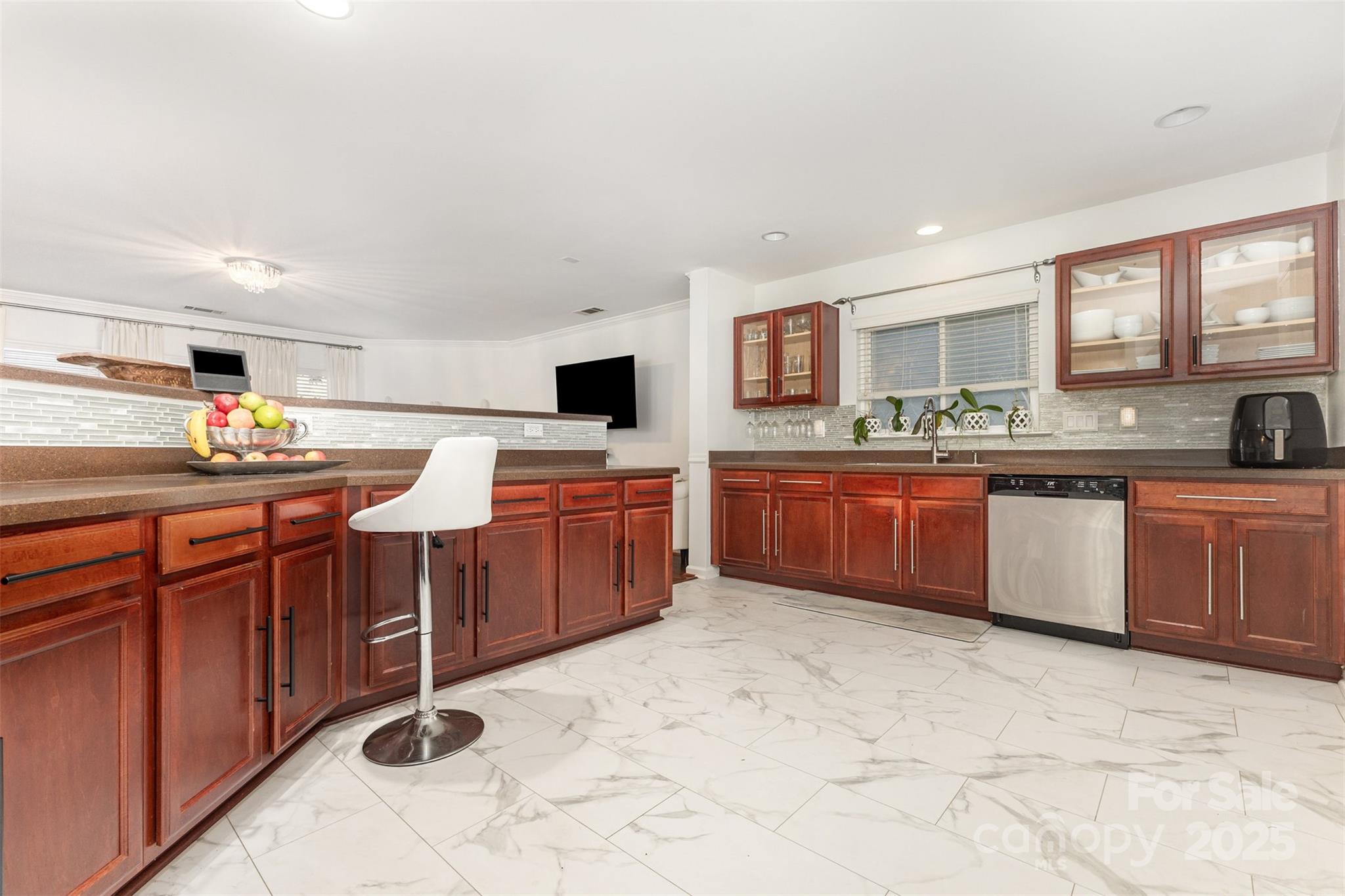6706 Evanton Loch Road Charlotte, NC 28278 - Photo 12 of 32 a kitchen with stainless steel appliances a sink and cabinets