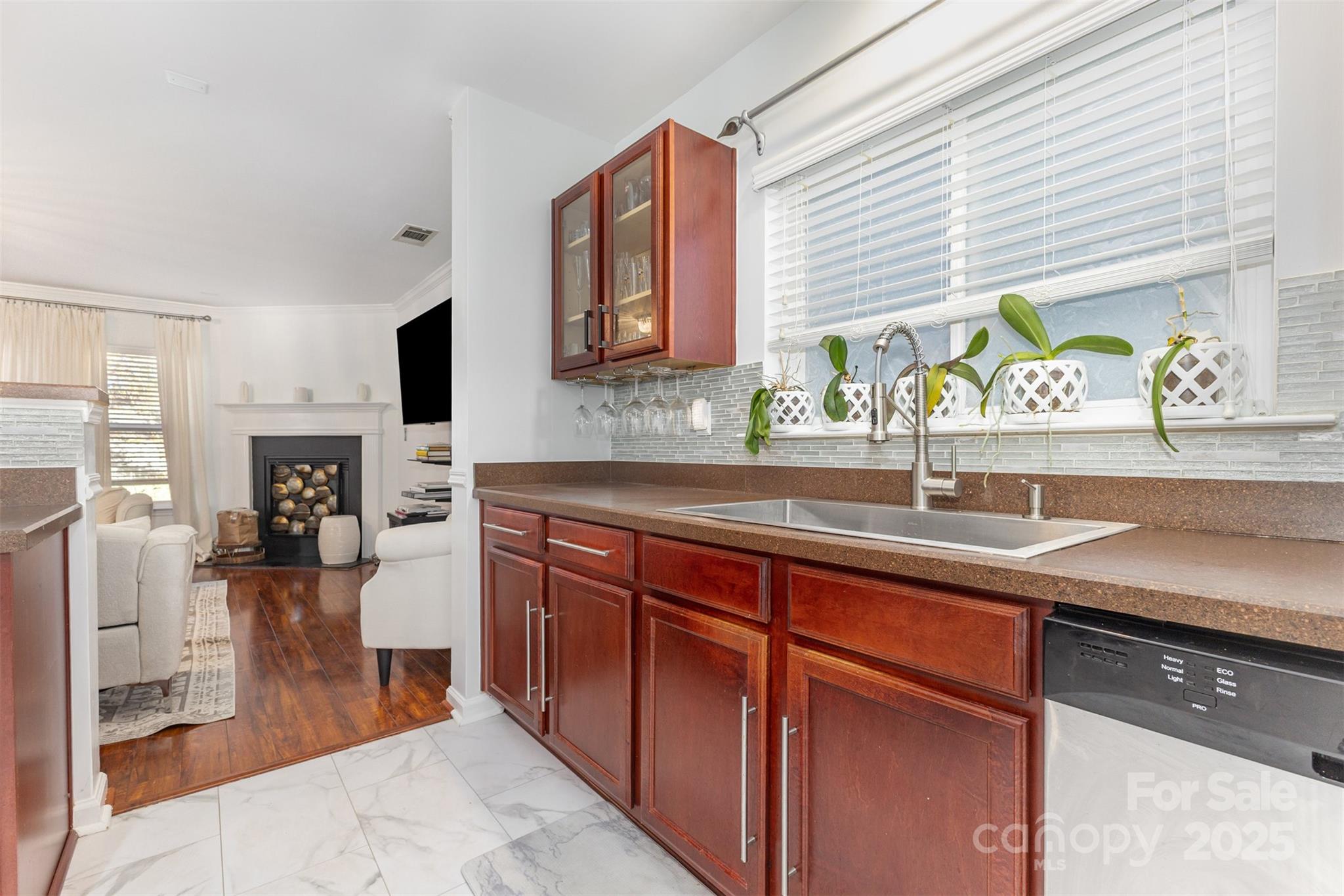 6706 Evanton Loch Road Charlotte, NC 28278 - Photo 14 of 32 a kitchen with stainless steel appliances granite countertop a sink stove and refrigerator