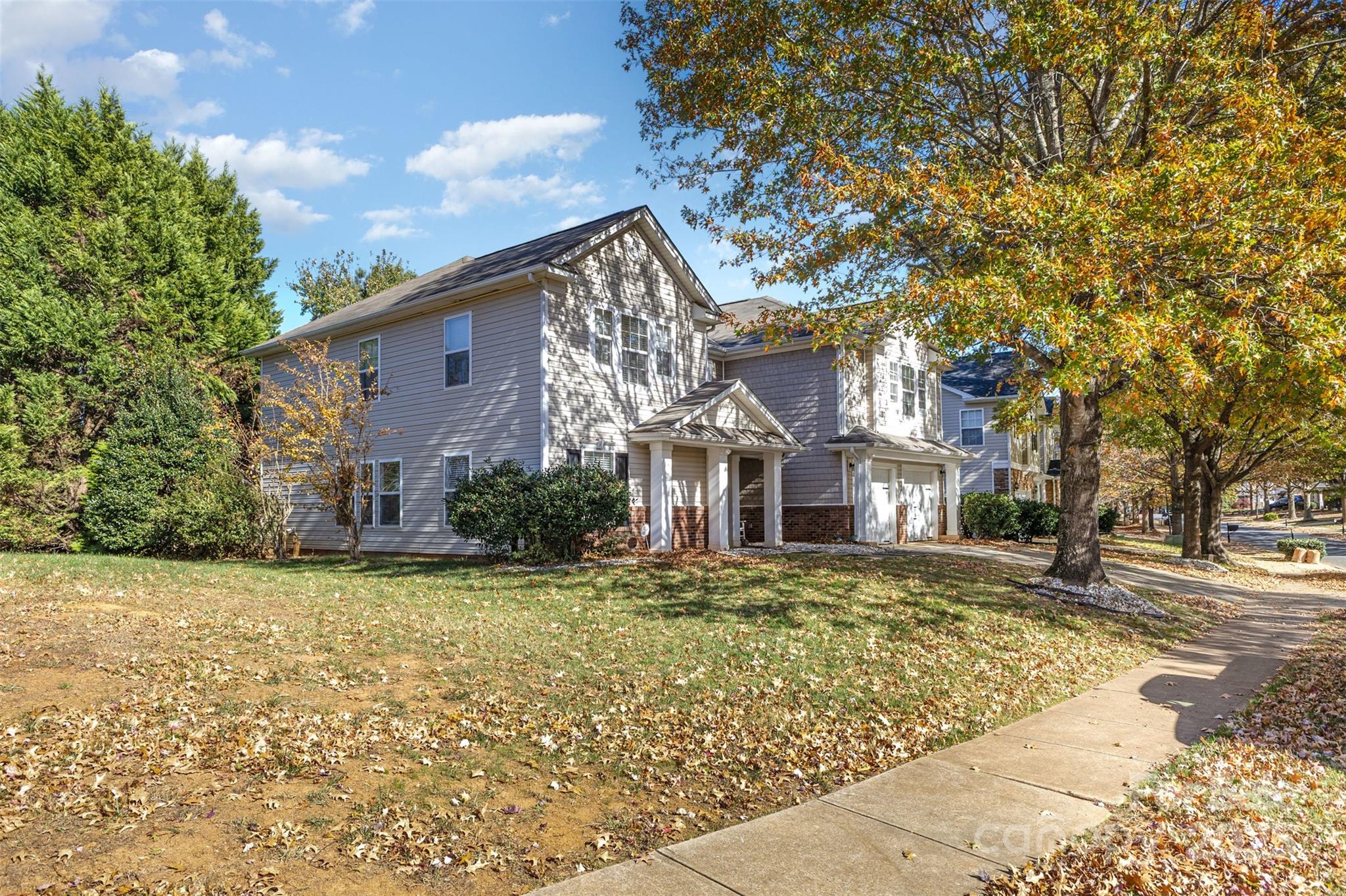 6706 Evanton Loch Road Charlotte, NC 28278 - Photo 2 of 32 a front view of a house with a yard