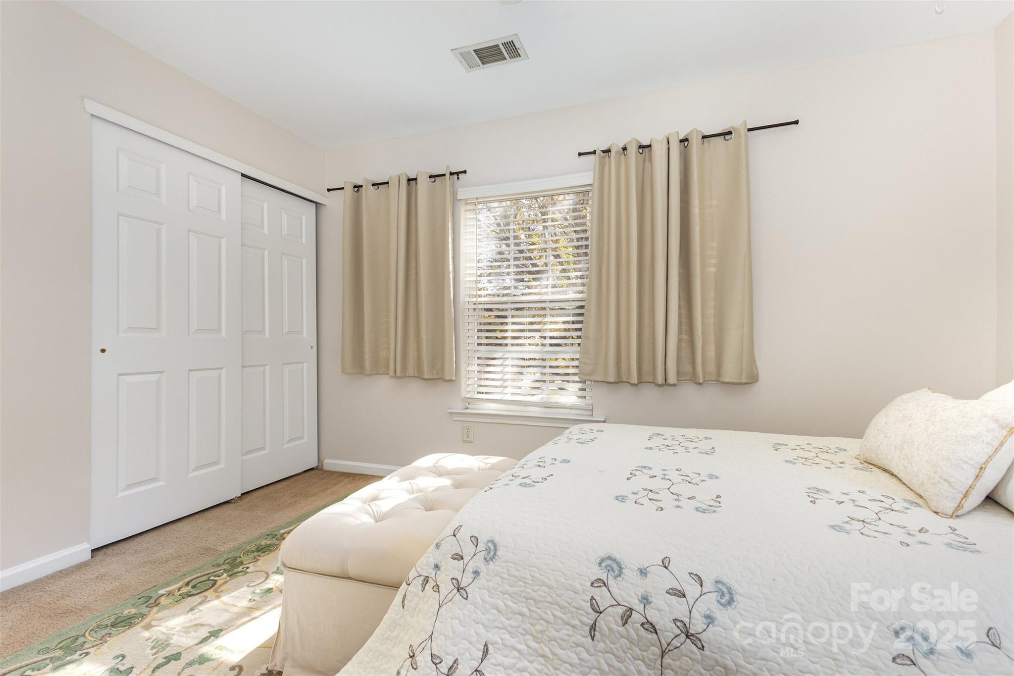 6706 Evanton Loch Road Charlotte, NC 28278 - Photo 25 of 32 a bedroom with a large bed and a window