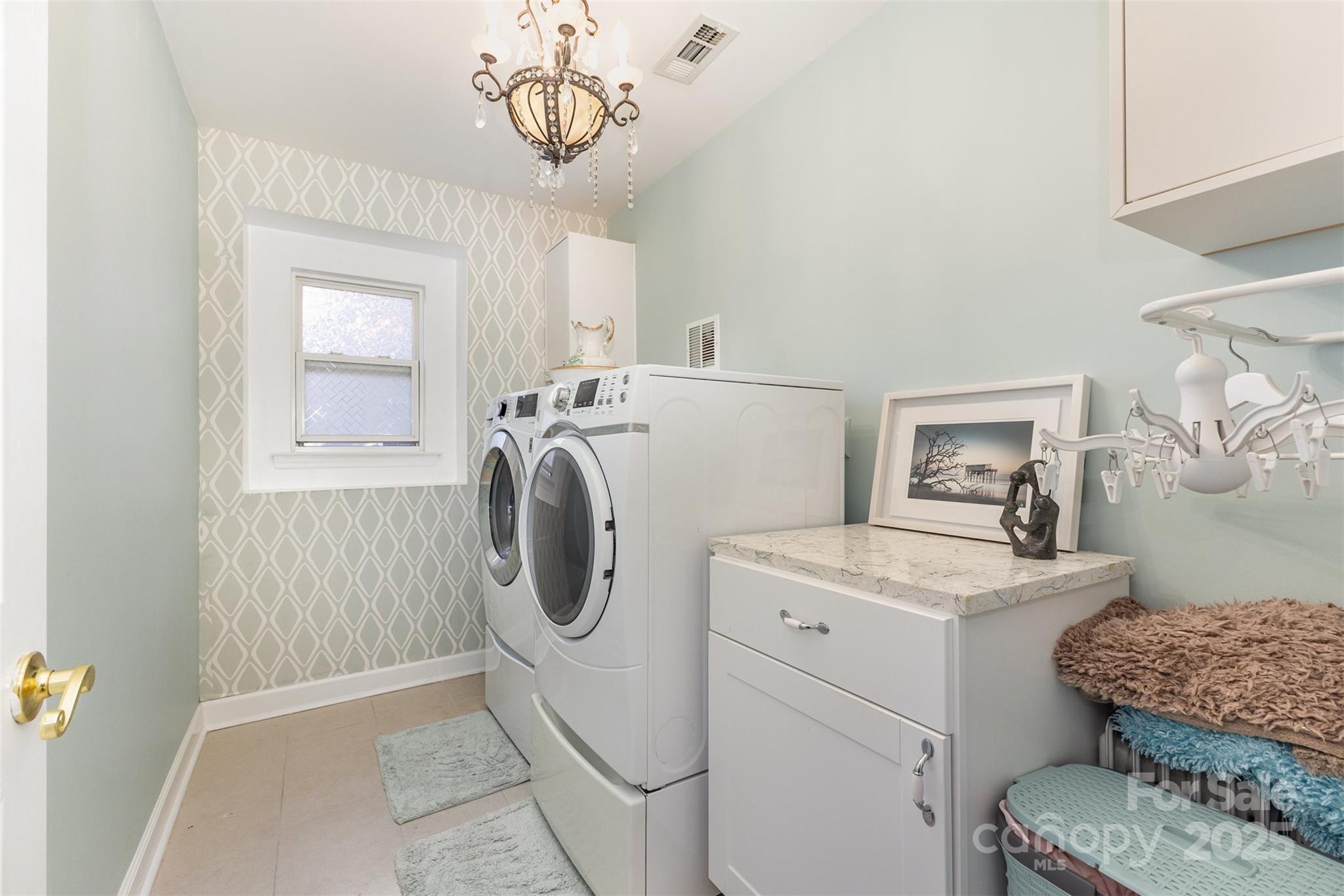 6706 Evanton Loch Road Charlotte, NC 28278 - Photo 30 of 32 a utility room with dryer and washer
