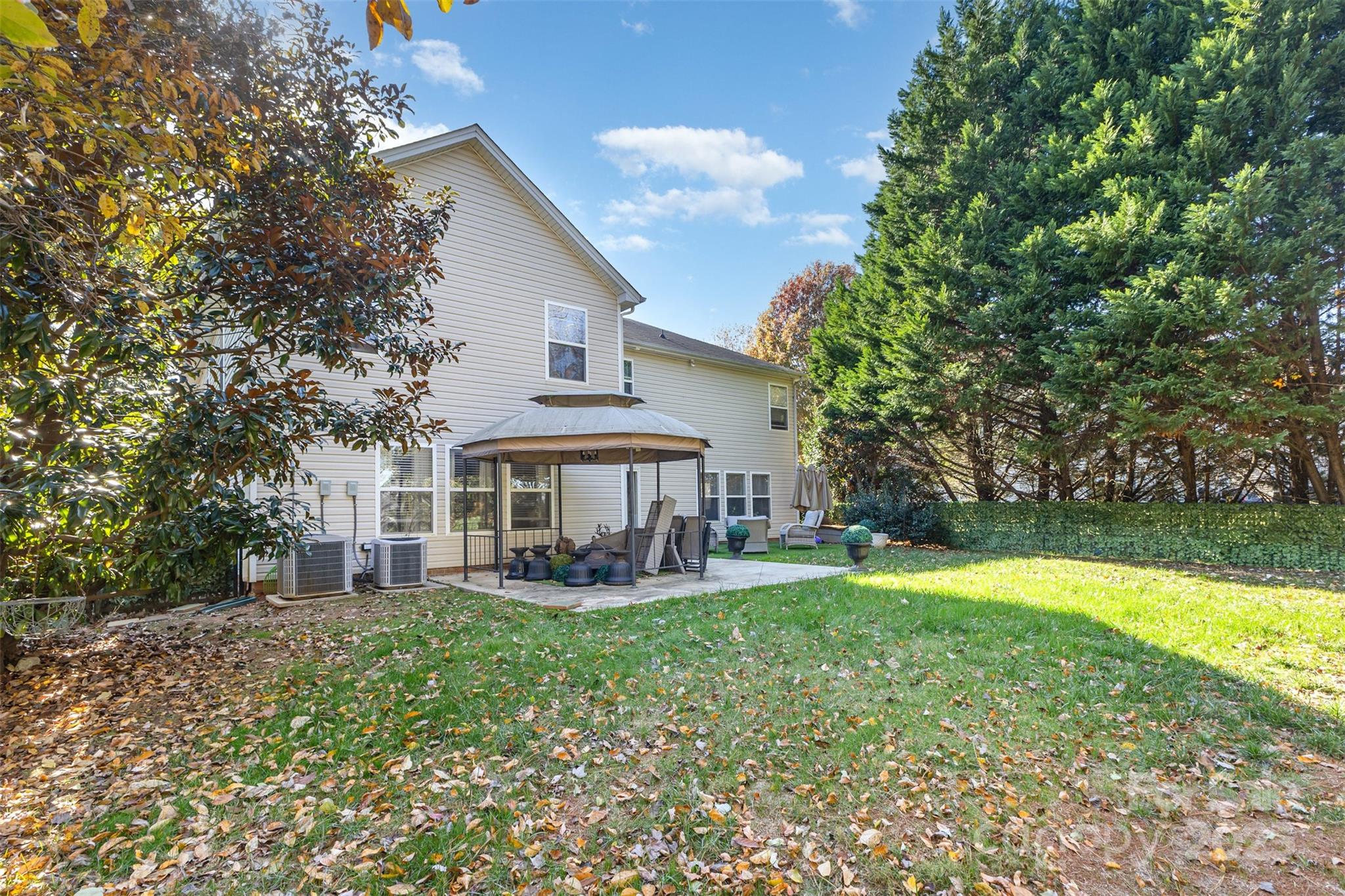 6706 Evanton Loch Road Charlotte, NC 28278 - Photo 31 of 32 a view of a house with a yard porch and sitting area