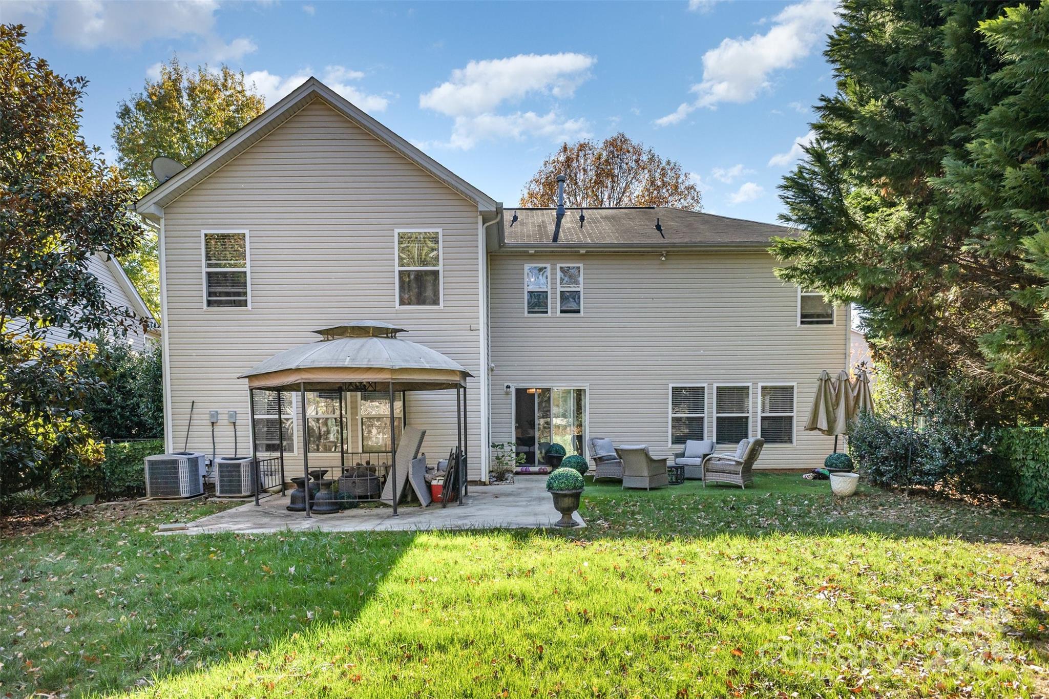 6706 Evanton Loch Road Charlotte, NC 28278 - Photo 32 of 32 a view of a house with a yard and furniture