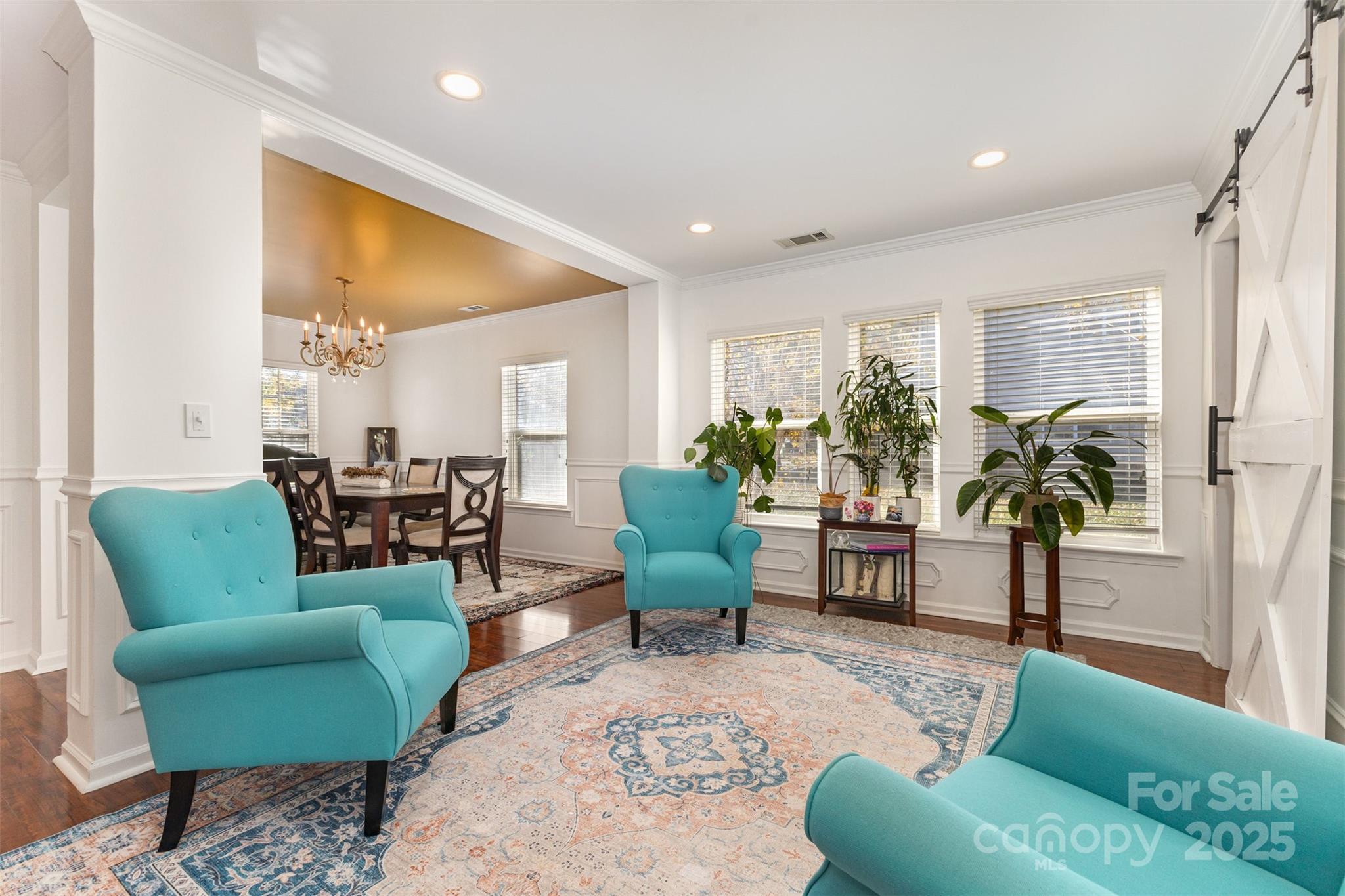 6706 Evanton Loch Road Charlotte, NC 28278 - Photo 5 of 32 a living room with furniture and a potted plant