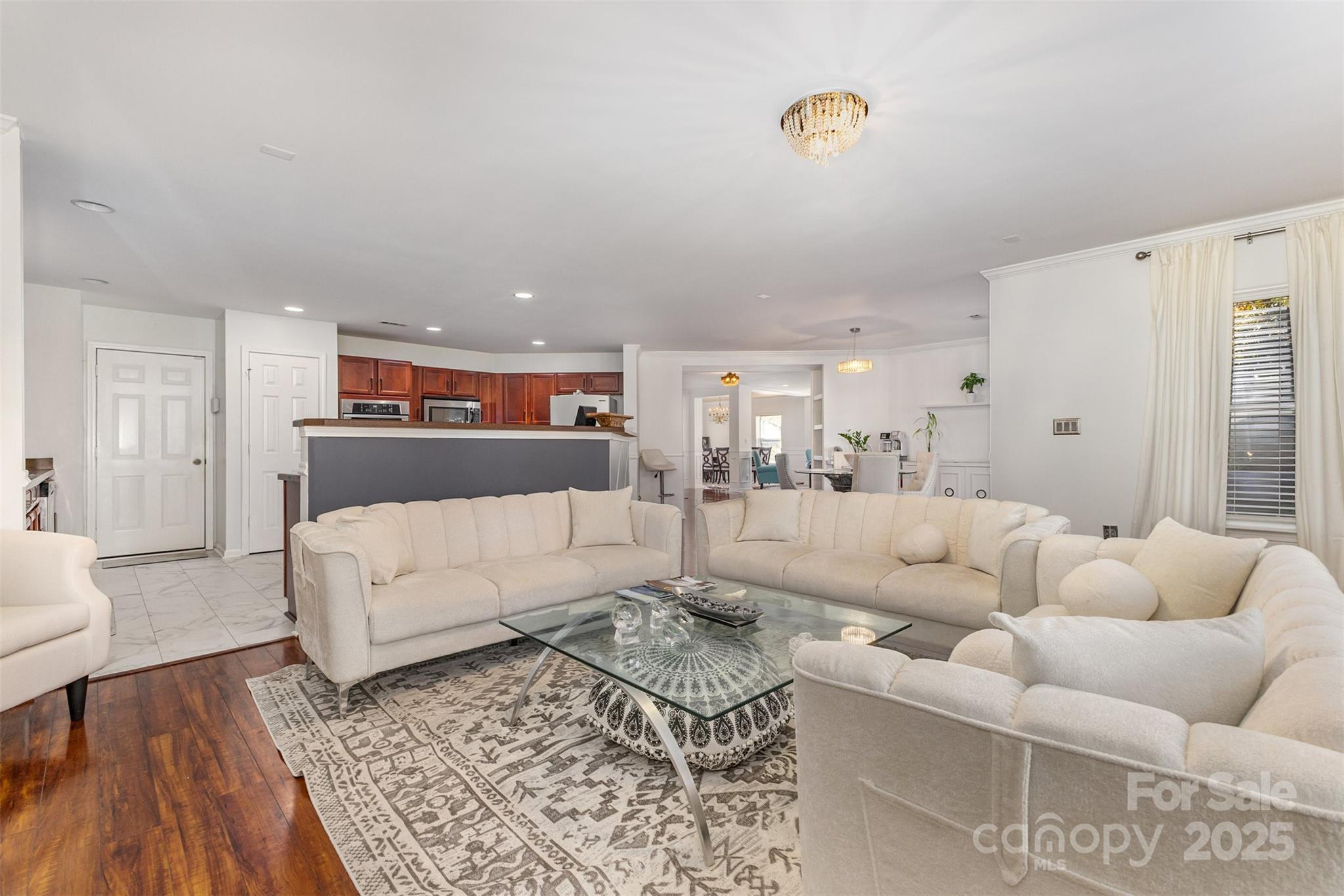 6706 Evanton Loch Road Charlotte, NC 28278 - Photo 9 of 32 a living room with furniture and a rug