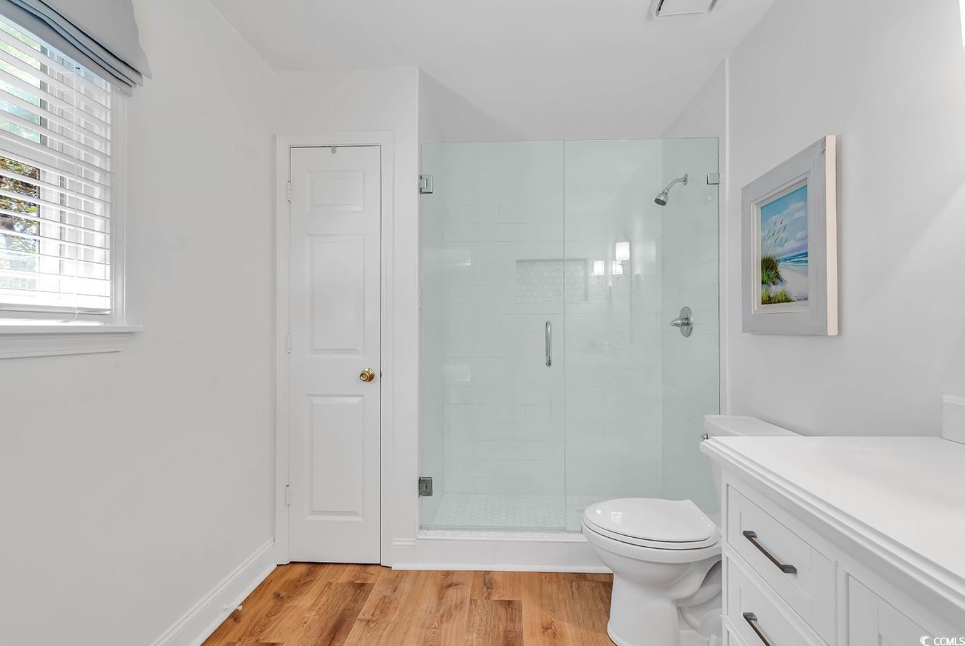 806 Keel Court Murrells Inlet, SC 29576 - Photo 12 of 35 Bathroom with wood-type flooring, a shower with do