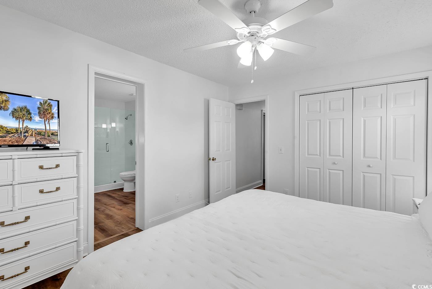 806 Keel Court Murrells Inlet, SC 29576 - Photo 8 of 35 Bedroom with dark wood-type flooring, a closet, a