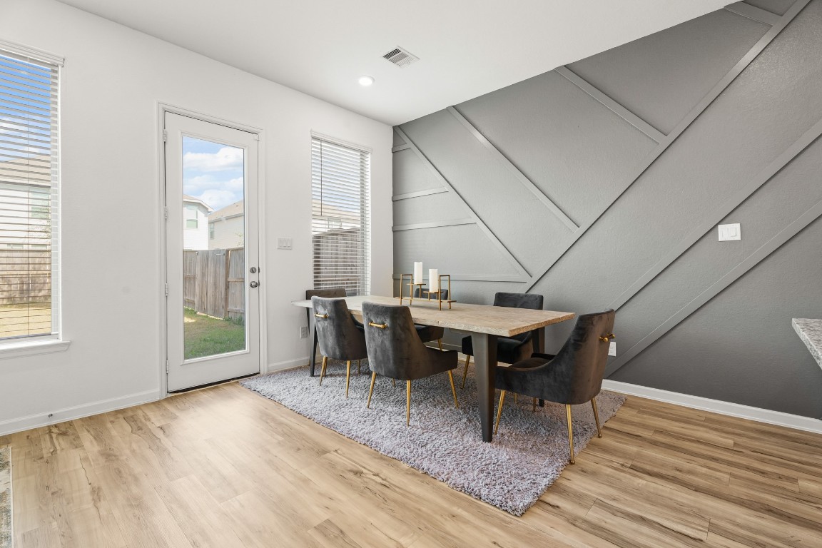 4103 Balboa Drive Iowa Colony, TX 77583 - Photo 11 of 30 a dining room with furniture and wooden floor