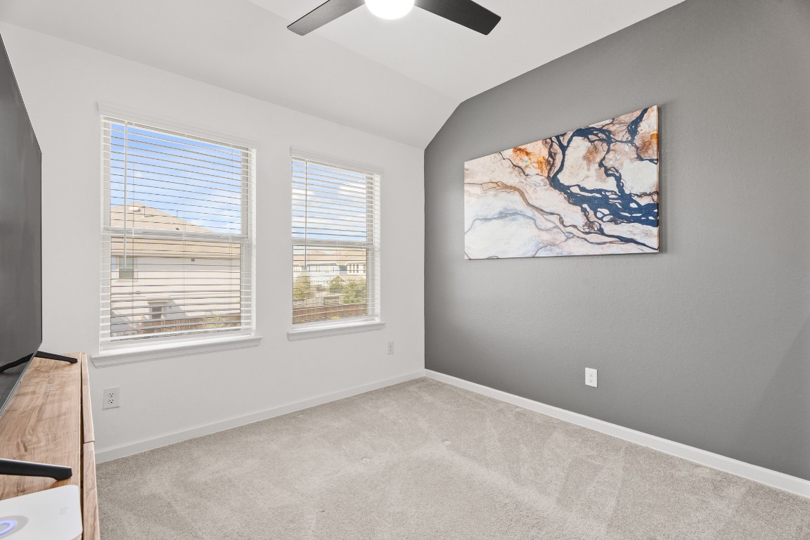 4103 Balboa Drive Iowa Colony, TX 77583 - Photo 12 of 30 an empty room with a window and a ceiling fan