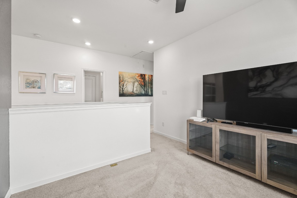 4103 Balboa Drive Iowa Colony, TX 77583 - Photo 13 of 30 a living room with stainless steel appliances furniture and a flat screen tv