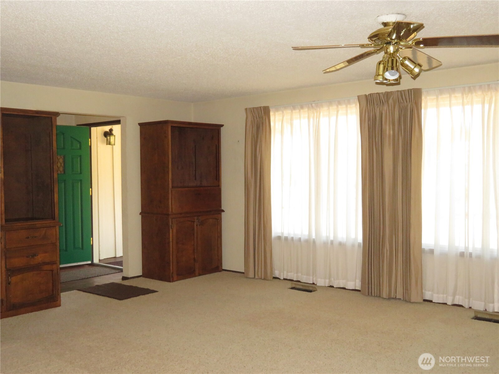 21 Wynoochee Valley Road Montesano, WA 98563 - Photo 19 of 38 an empty room with windows and a chandelier fan