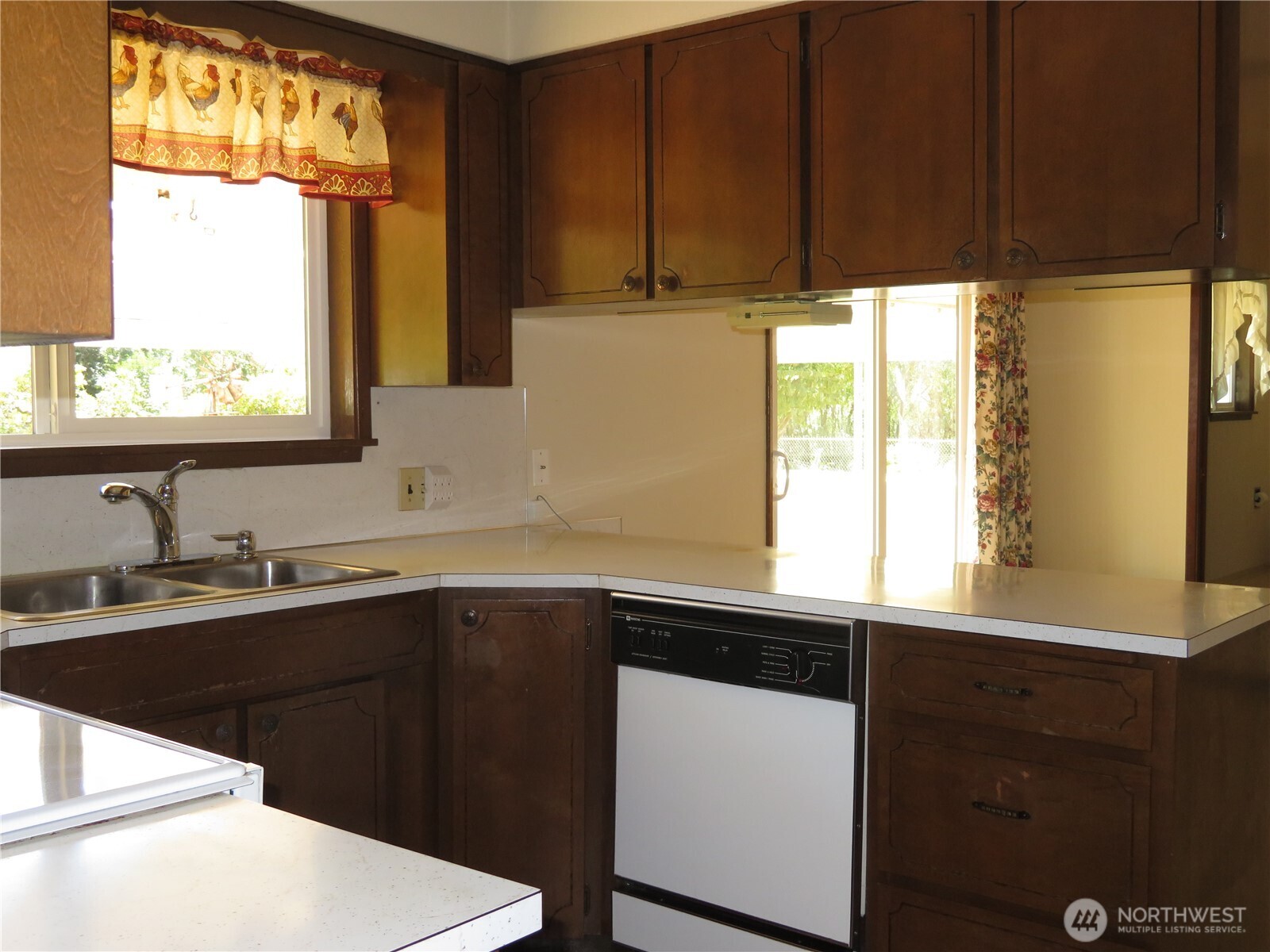 21 Wynoochee Valley Road Montesano, WA 98563 - Photo 20 of 38 a kitchen with a sink a window and cabinets