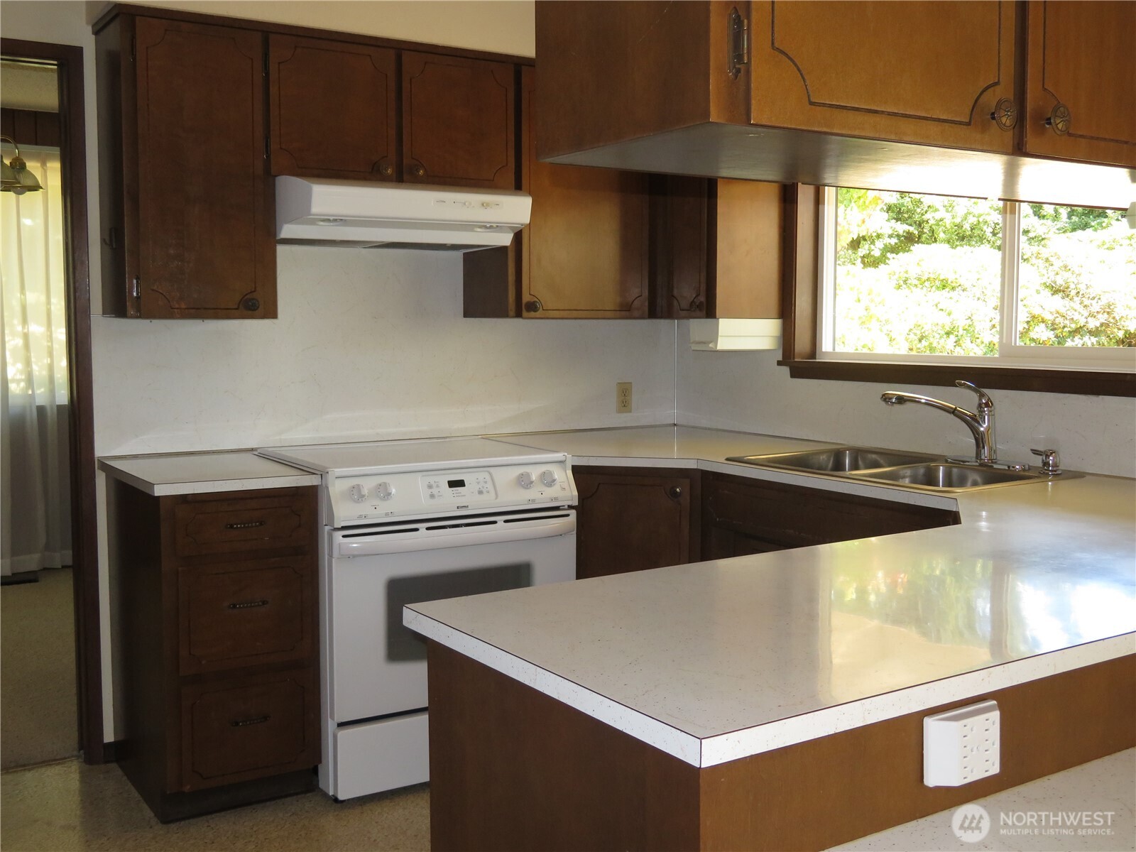 21 Wynoochee Valley Road Montesano, WA 98563 - Photo 21 of 38 a view of a kitchen with a sink and a stove top oven