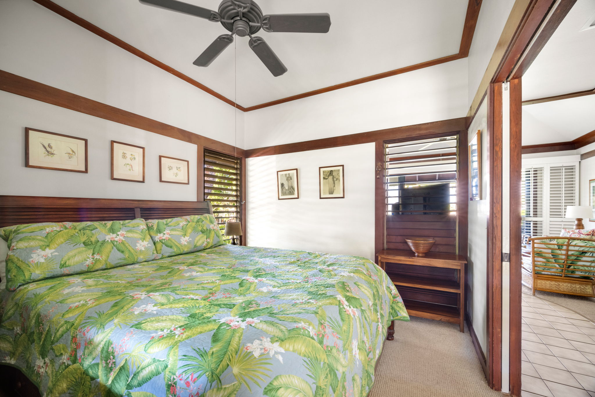 2253 Poipu Road, Unit 25 Koloa, HI 96756 - Photo 15 of 29 a bedroom with a bed and a painting on the wall