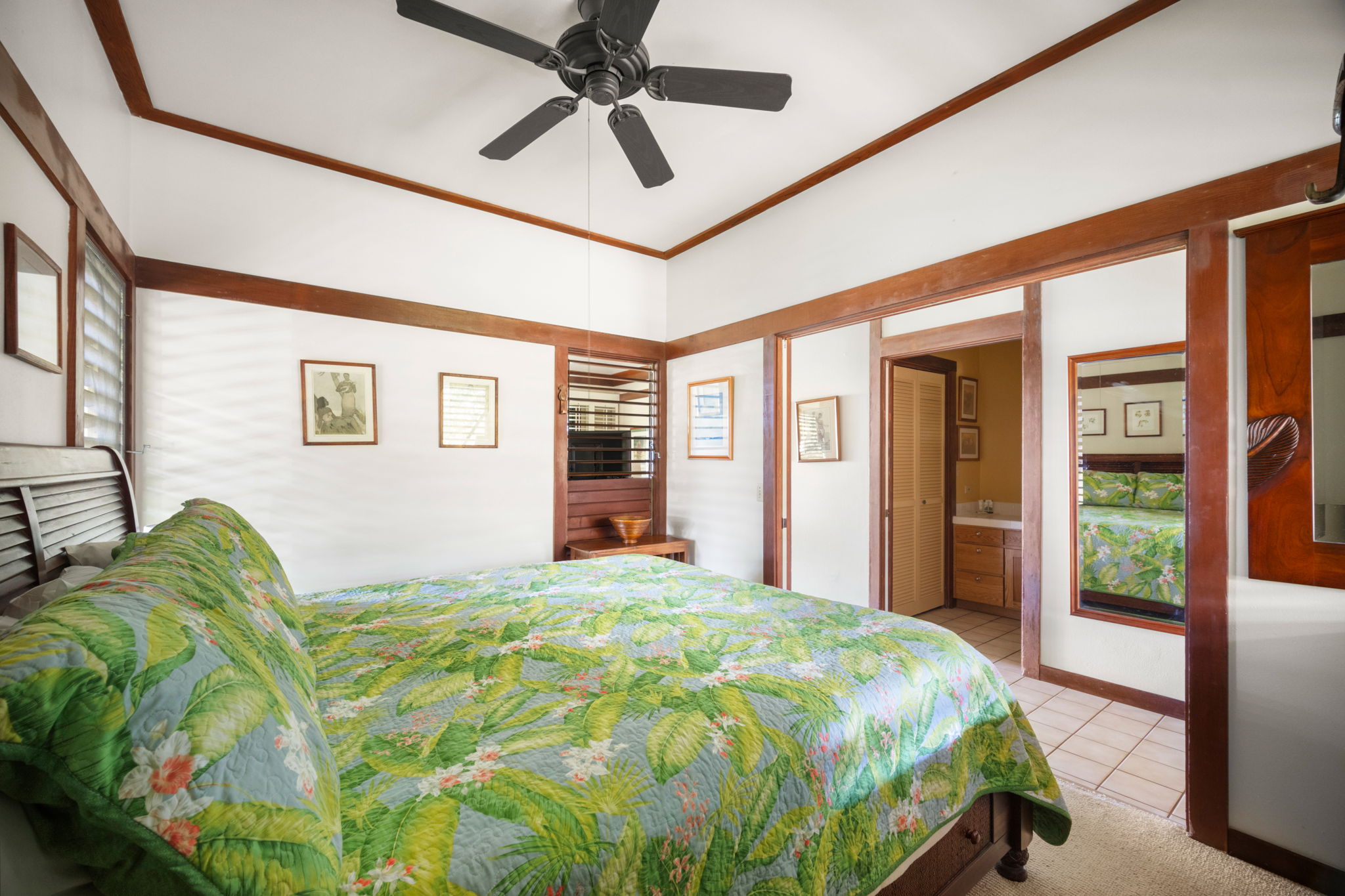 2253 Poipu Road, Unit 25 Koloa, HI 96756 - Photo 16 of 29 a bed sitting in a spacious bedroom next to a window