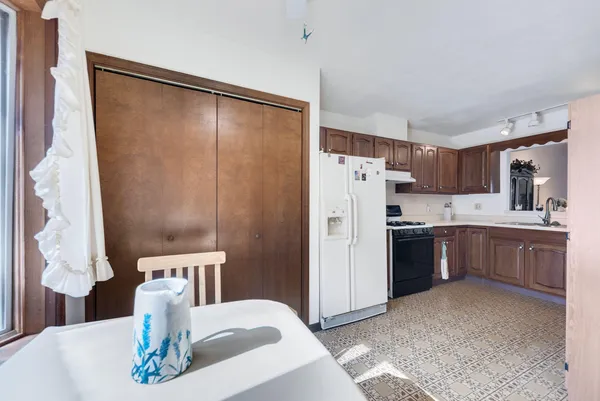 a kitchen with stainless steel appliances a refrigerator and a sink