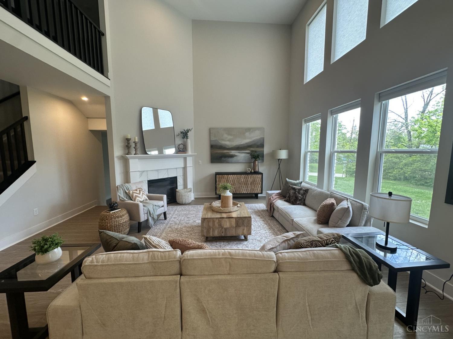 11134 Snider Road Cincinnati, OH 45249 - Photo 13 of 42 Great room with wall of windows overlooking the back yard. Electric fireplace