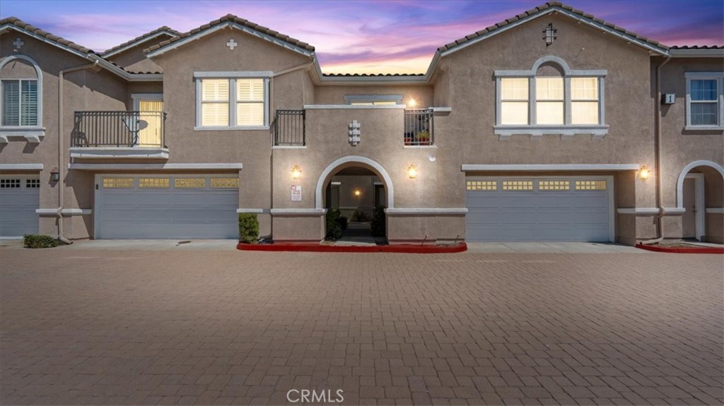 11450 Church Street, Unit 4 Rancho Cucamonga, CA 91730 - Photo 1 of 38 a front view of a house with a garage