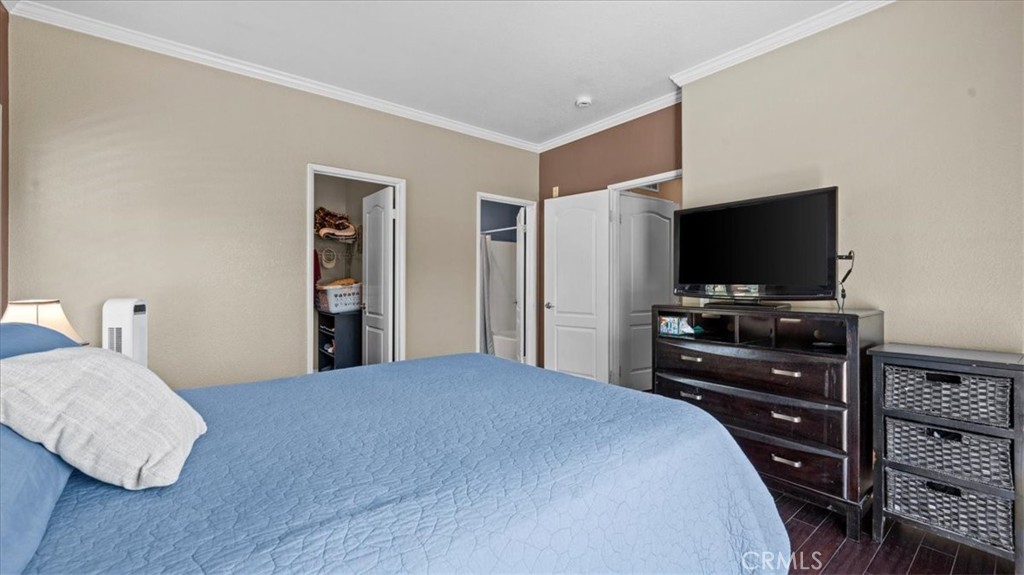 11450 Church Street, Unit 4 Rancho Cucamonga, CA 91730 - Photo 17 of 38 a bedroom with a bed and a flat screen tv