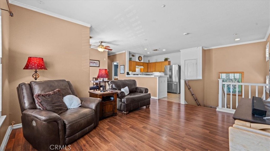 11450 Church Street, Unit 4 Rancho Cucamonga, CA 91730 - Photo 7 of 38 a living room with furniture kitchen view and a wooden floor