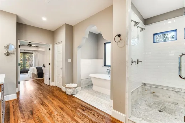 a bathroom with a glass shower door