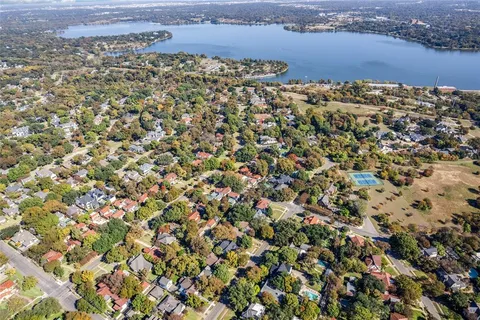 an aerial view of a houses with ocean view