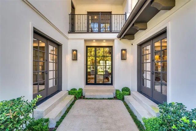 a view of a brick house with many windows