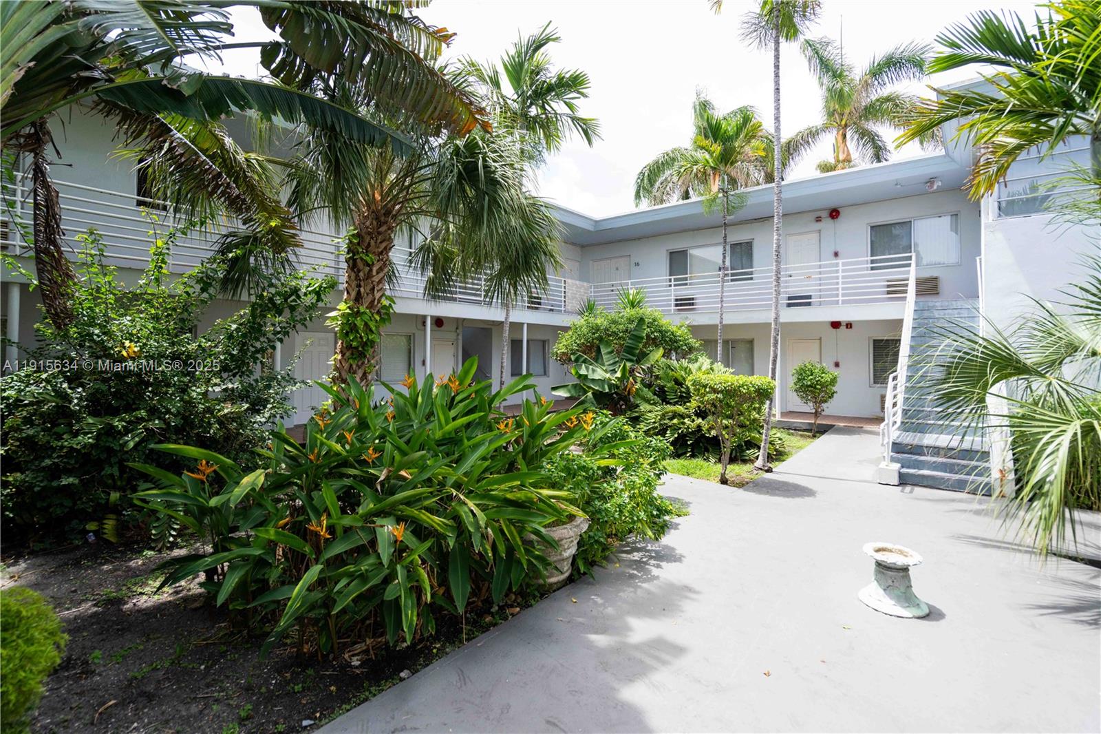 8315 Byron Avenue, Unit 2A Miami Beach, FL 33141 - Photo 10 of 13 a view of a house with a yard