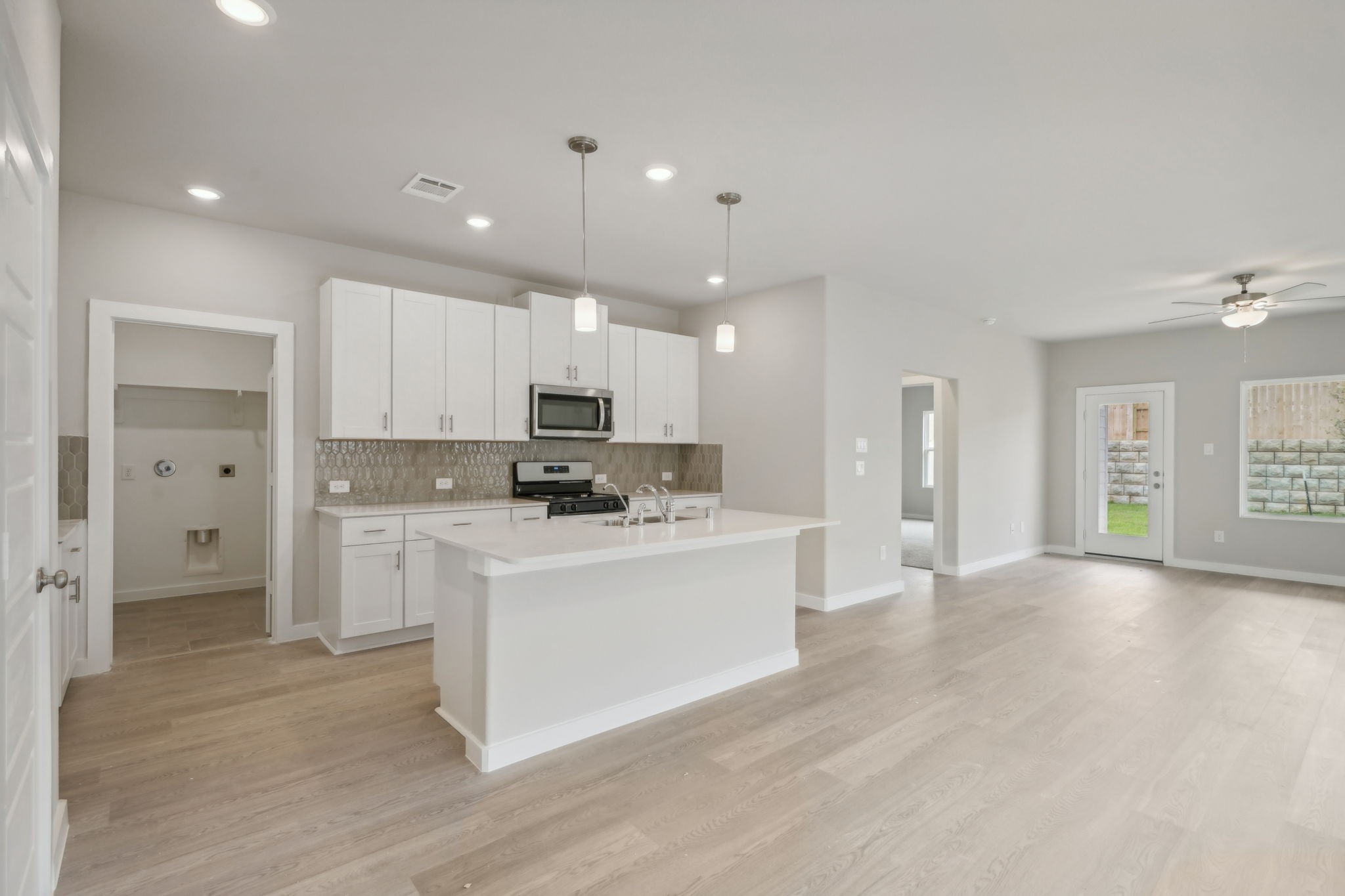 14309 Grey Pointe Court Conroe, TX 77302 - Photo 1 of 22 Photo is not of the actual home, but is an inspirational photo of builder’s model home and may depict options, furnishings, and/or decorator features that are not included