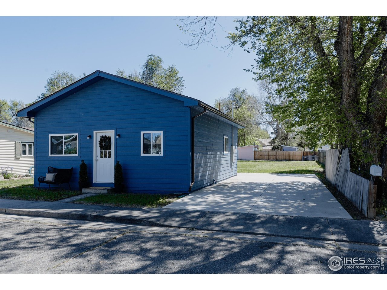 934 6th Street Berthoud, CO 80513 - Photo 2 of 28 a view of backyard of house with trees