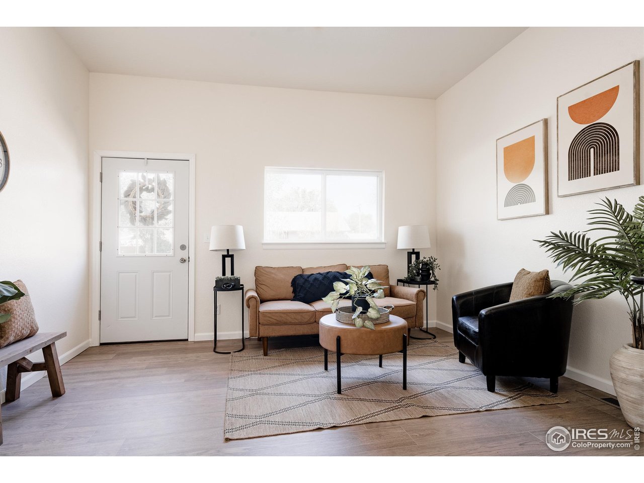 934 6th Street Berthoud, CO 80513 - Photo 3 of 28 a living room with furniture and a window