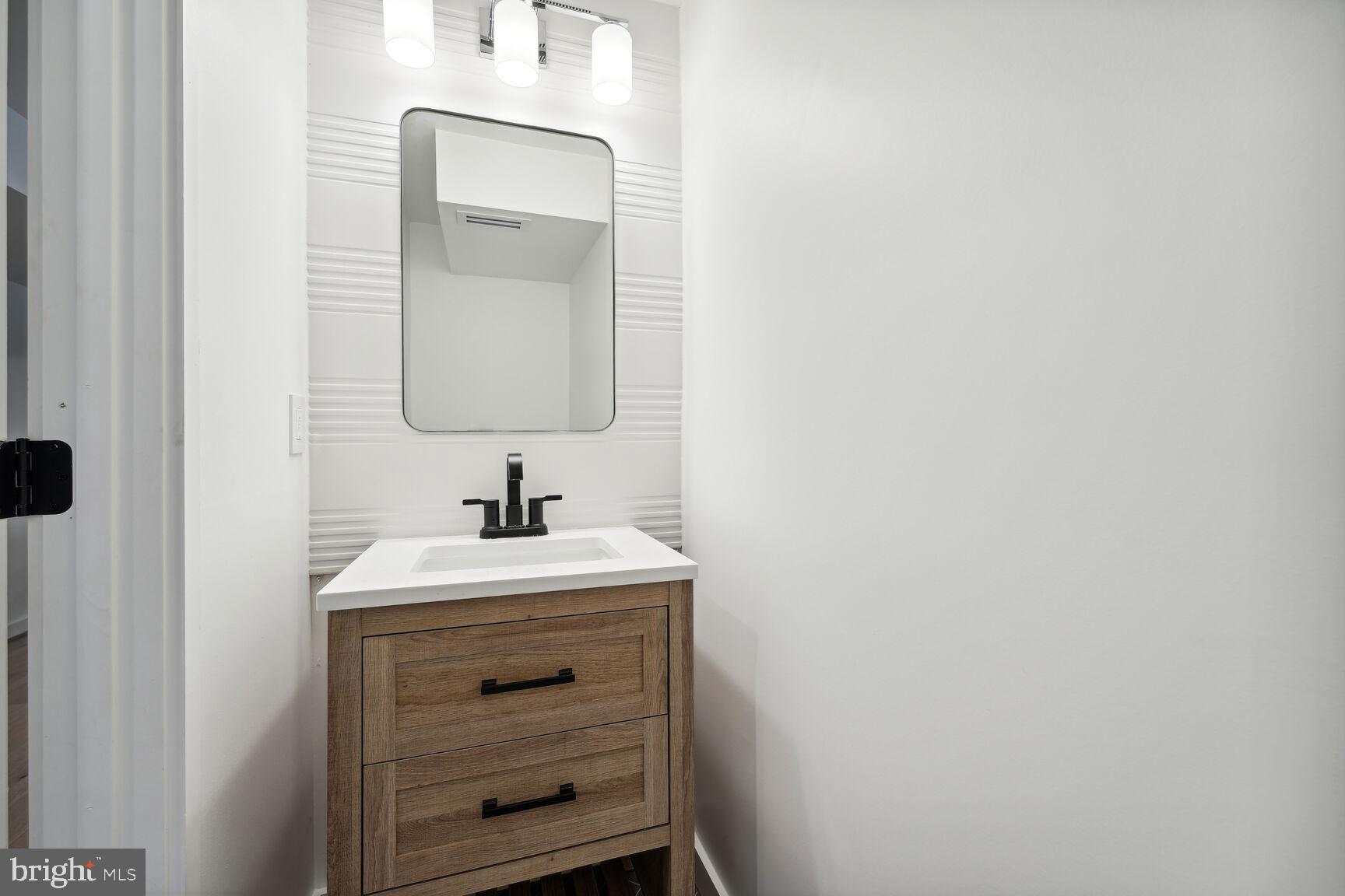 7318 Rippon Road Alexandria, VA 22307 - Photo 41 of 57 Entryway powder room