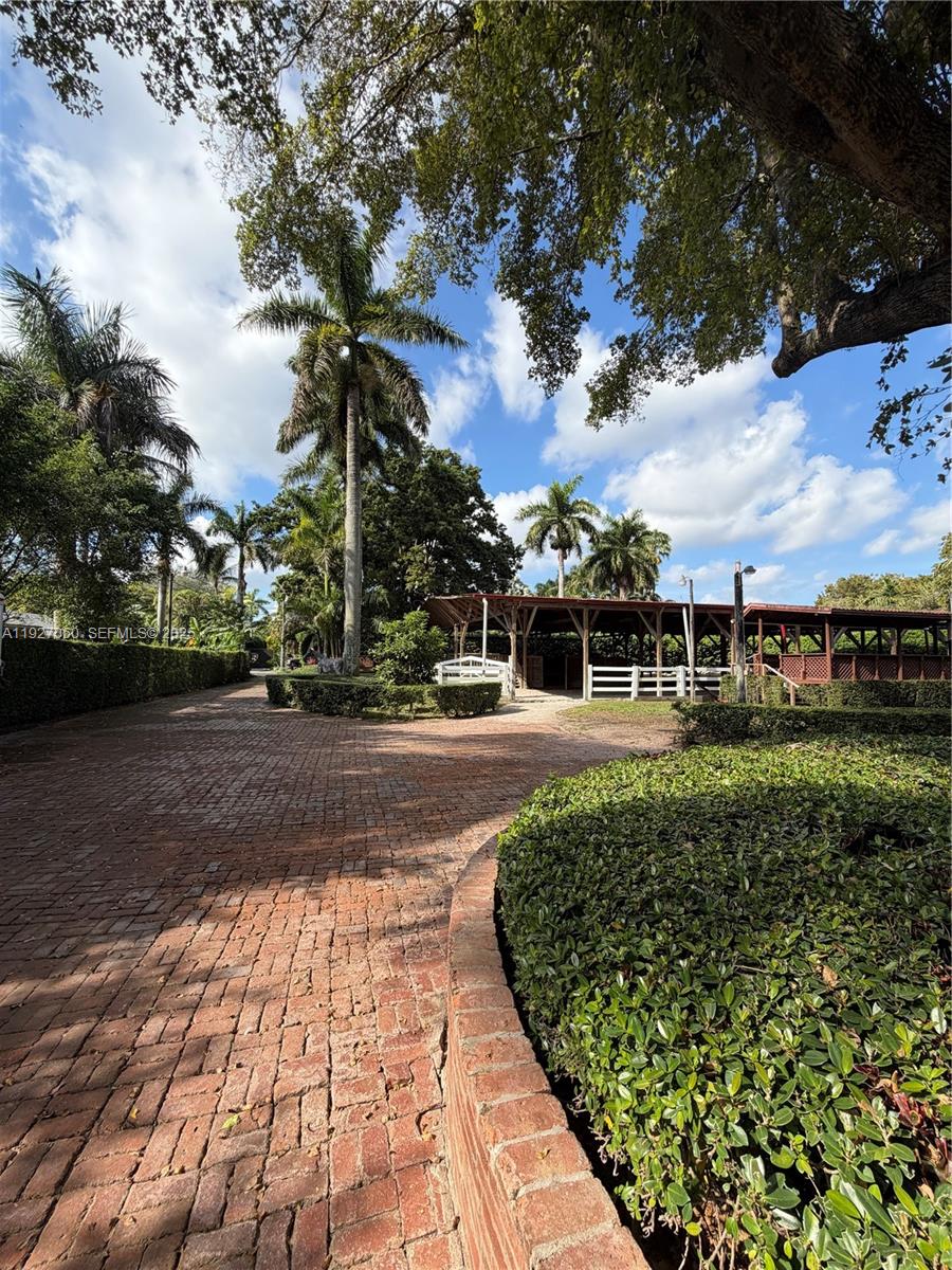 5877 Southwest 123rd Avenue, Unit MAIN Miami, FL 33183 - Photo 1 of 34 a view of a garden