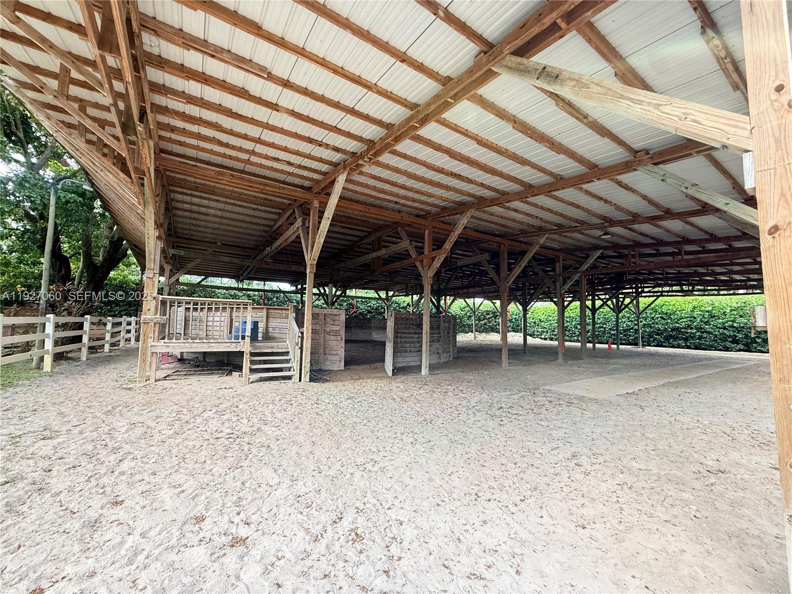 5877 Southwest 123rd Avenue, Unit MAIN Miami, FL 33183 - Photo 24 of 34 a view of a big room with wooden roof and sitting area