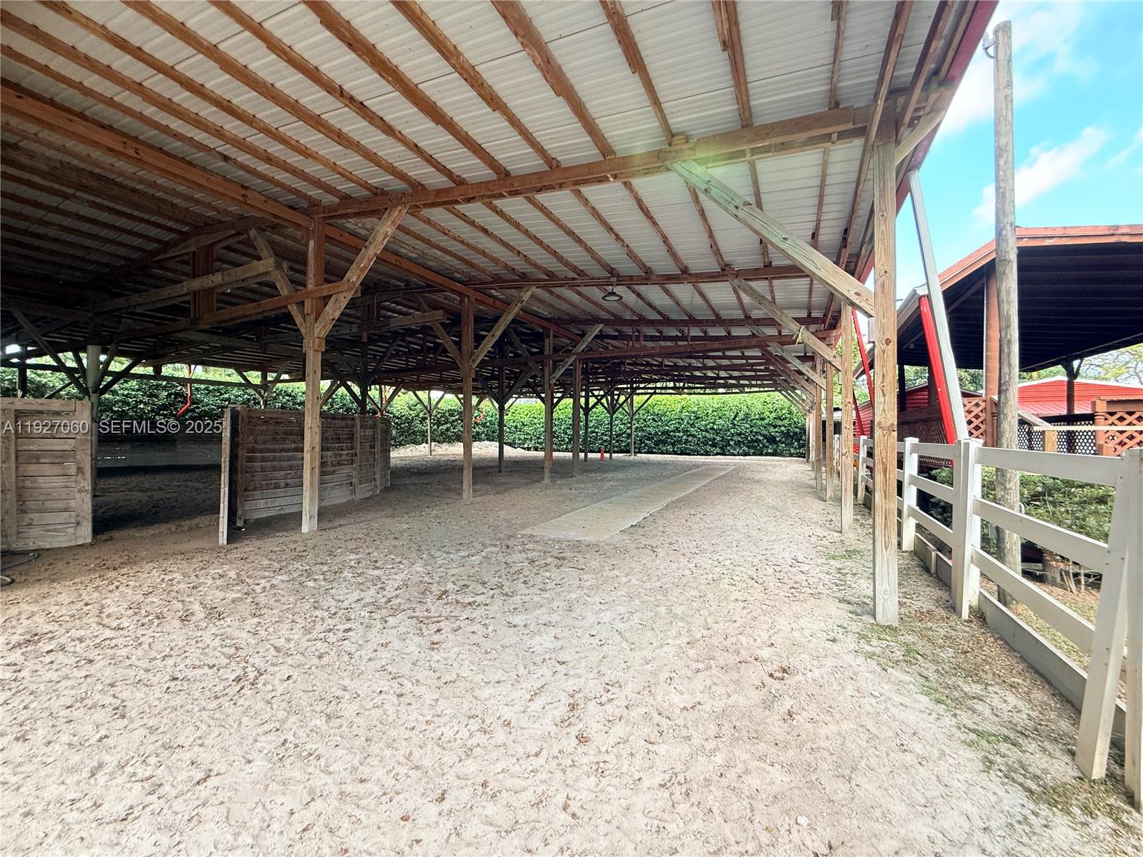 5877 Southwest 123rd Avenue, Unit MAIN Miami, FL 33183 - Photo 26 of 34 a view of a big room with wooden roof