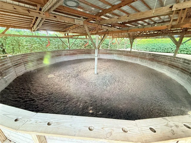 a view of a house with a yard and large trees