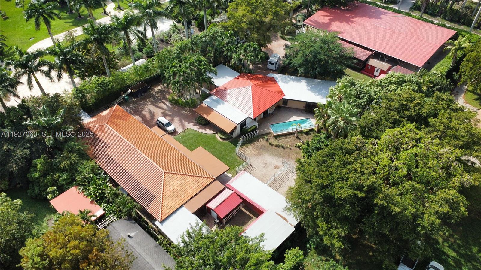 5877 Southwest 123rd Avenue, Unit MAIN Miami, FL 33183 - Photo 32 of 34 an aerial view of residential house with outdoor space and swimming pool
