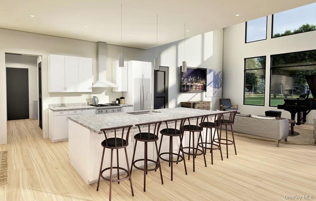 2 Chelsea Road Wappingers Falls, NY 12590 - Photo 2 of 12 a kitchen with stainless steel appliances granite countertop a stove a sink dishwasher and a refrigerator with wooden floor