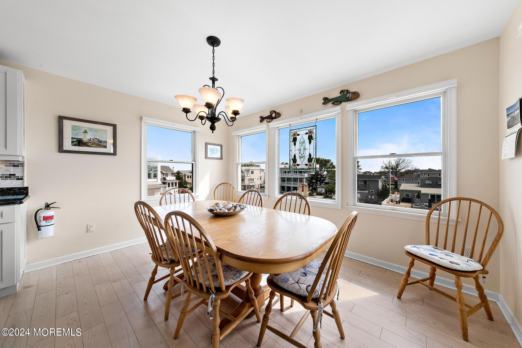 10 Arnold Boulevard Beach Haven, NJ 08008 - Photo 14 of 81 a dining room with furniture a chandelier and wooden floor
