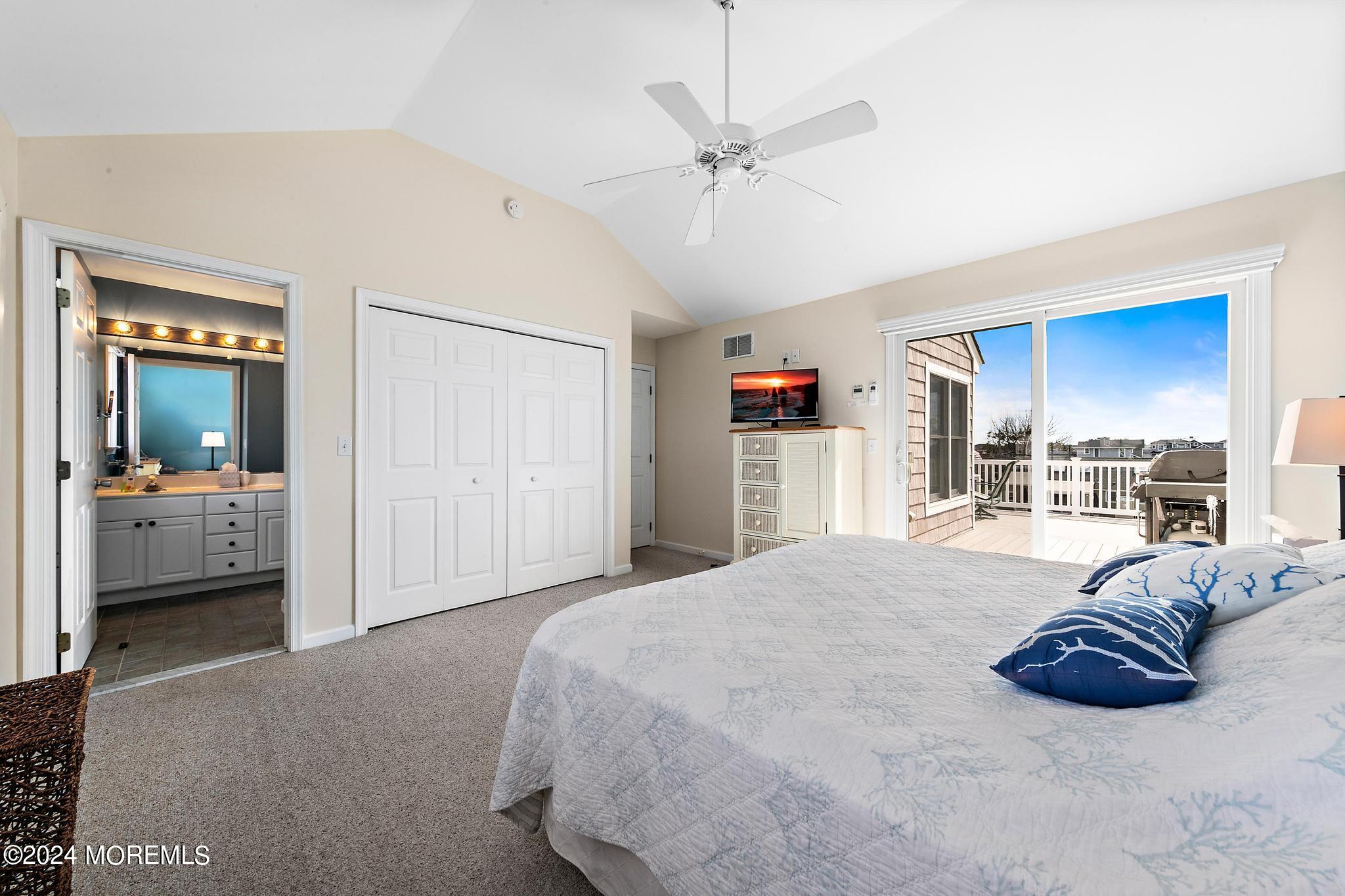 10 Arnold Boulevard Beach Haven, NJ 08008 - Photo 17 of 81 a spacious bedroom with a bed and a large mirror