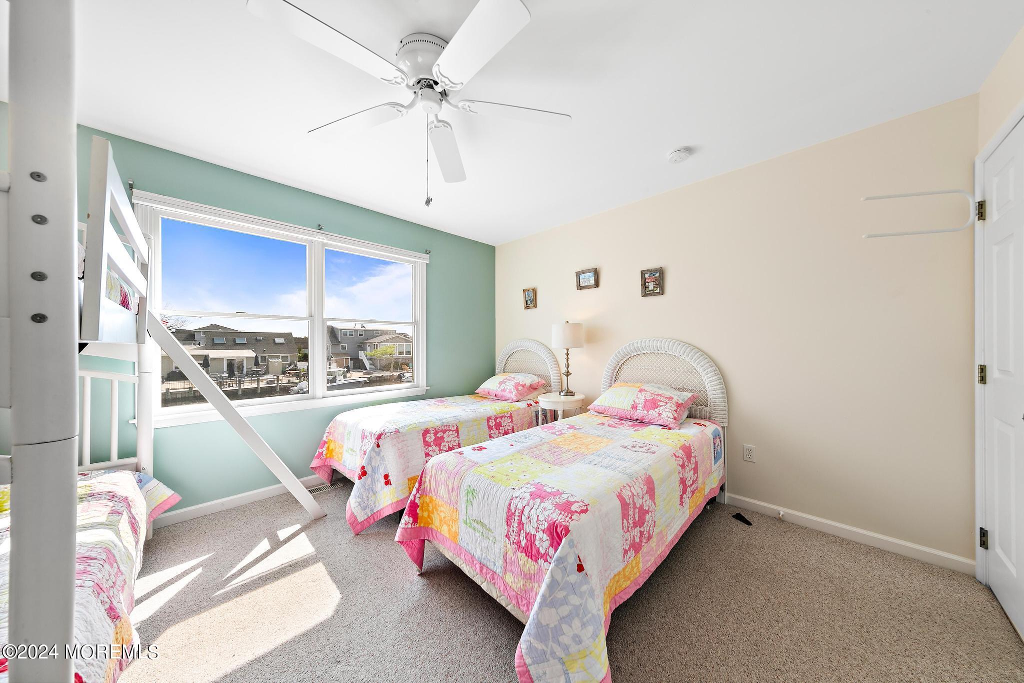10 Arnold Boulevard Beach Haven, NJ 08008 - Photo 22 of 81 a bedroom with a bed and window