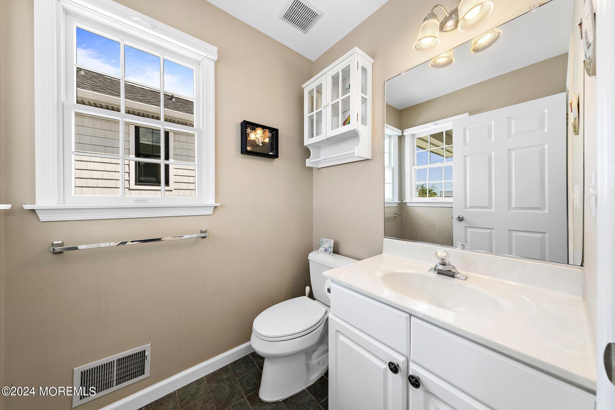 10 Arnold Boulevard Beach Haven, NJ 08008 - Photo 34 of 81 a bathroom with a sink toilet and window