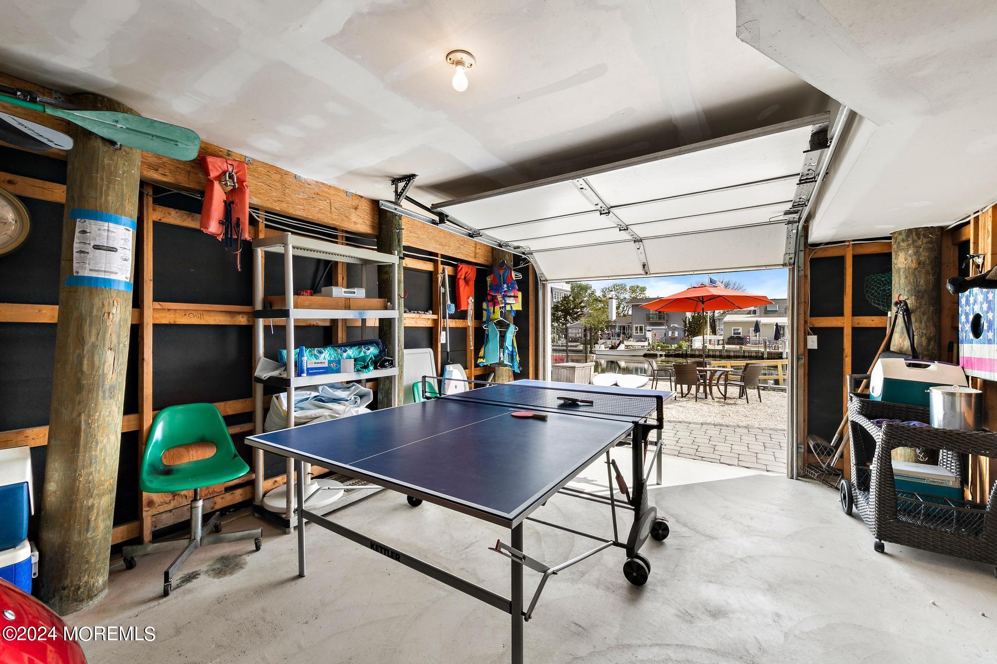 10 Arnold Boulevard Beach Haven, NJ 08008 - Photo 38 of 81 a living room with furniture a rug and a table