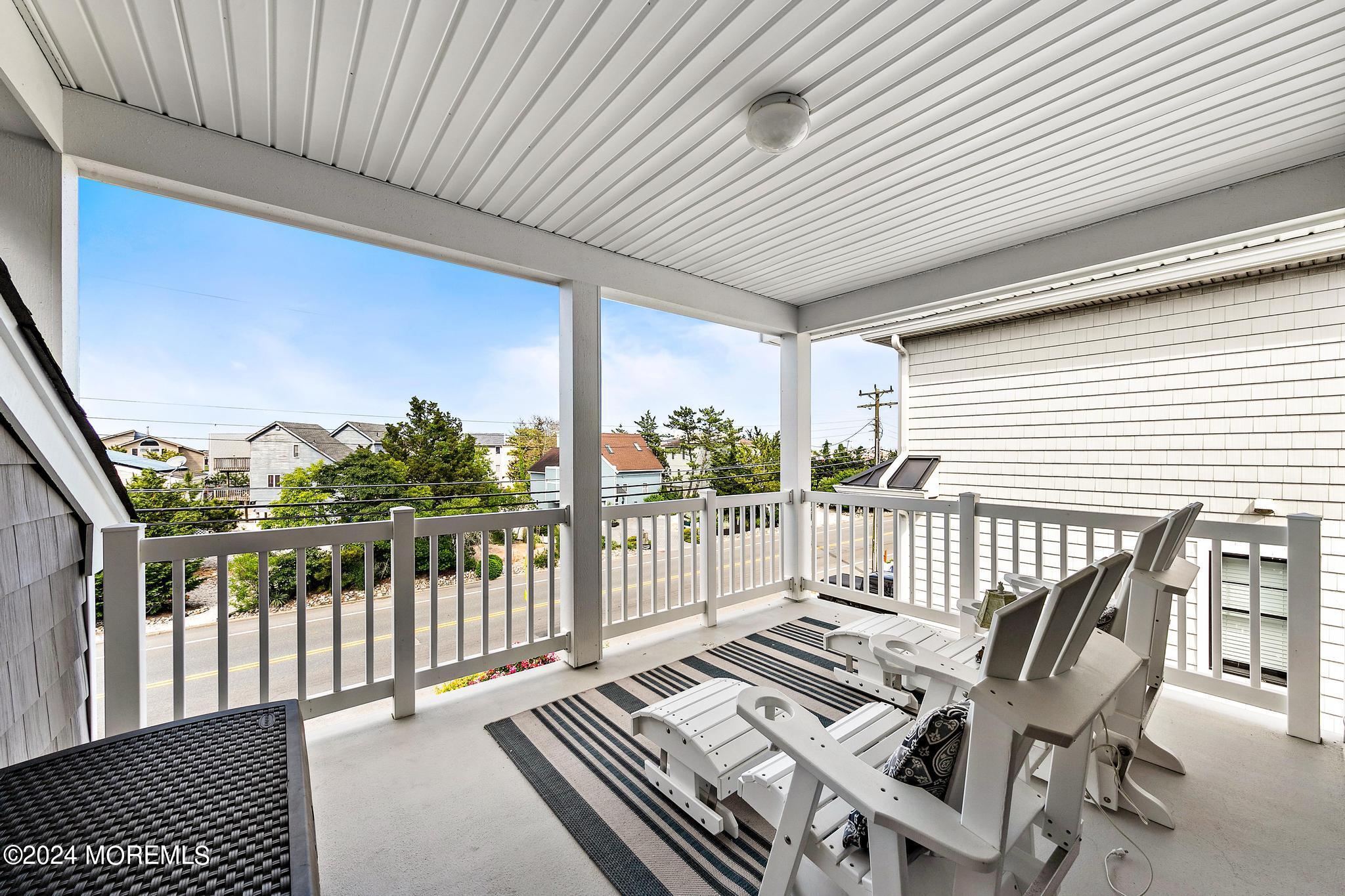 10 Arnold Boulevard Beach Haven, NJ 08008 - Photo 45 of 81 a view of a balcony with chairs