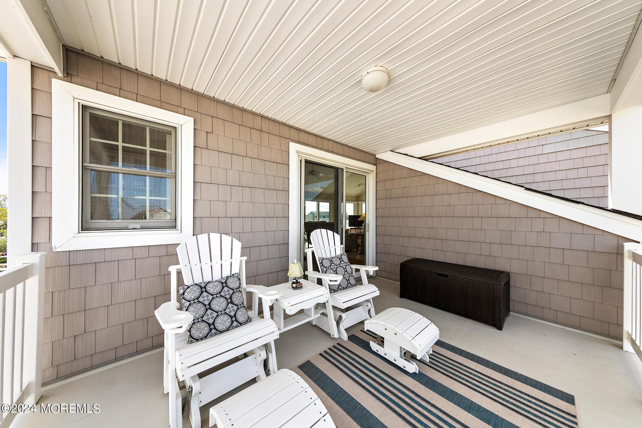 10 Arnold Boulevard Beach Haven, NJ 08008 - Photo 46 of 81 a balcony view with a couch and wooden floor