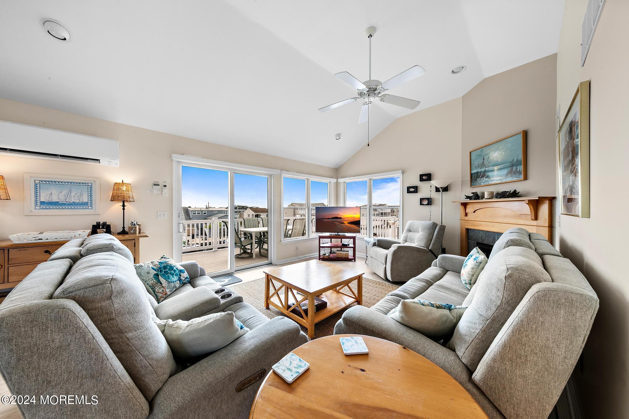 10 Arnold Boulevard Beach Haven, NJ 08008 - Photo 6 of 81 a living room with furniture kitchen view and a flat screen tv