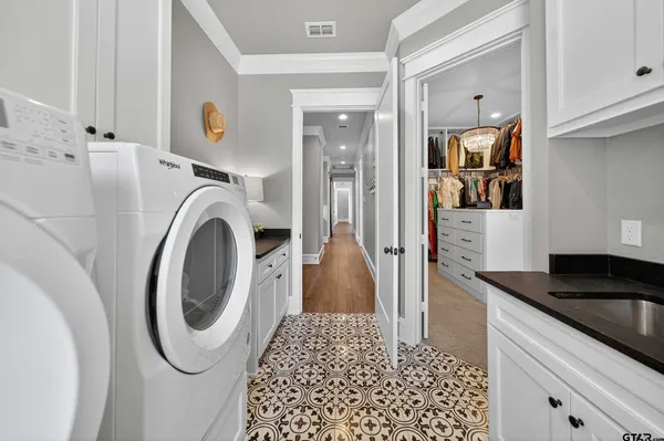 a kitchen with a refrigerator and a stove