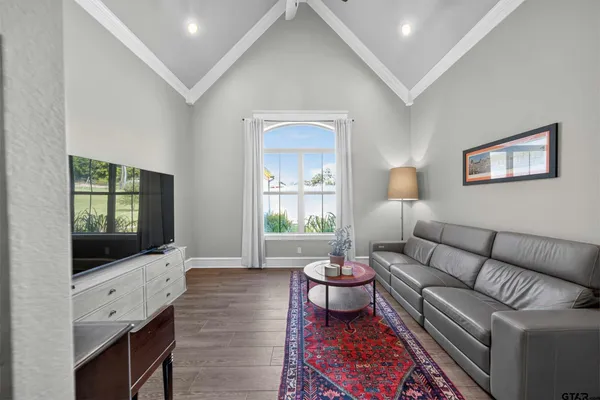 a living room with furniture and a flat screen tv